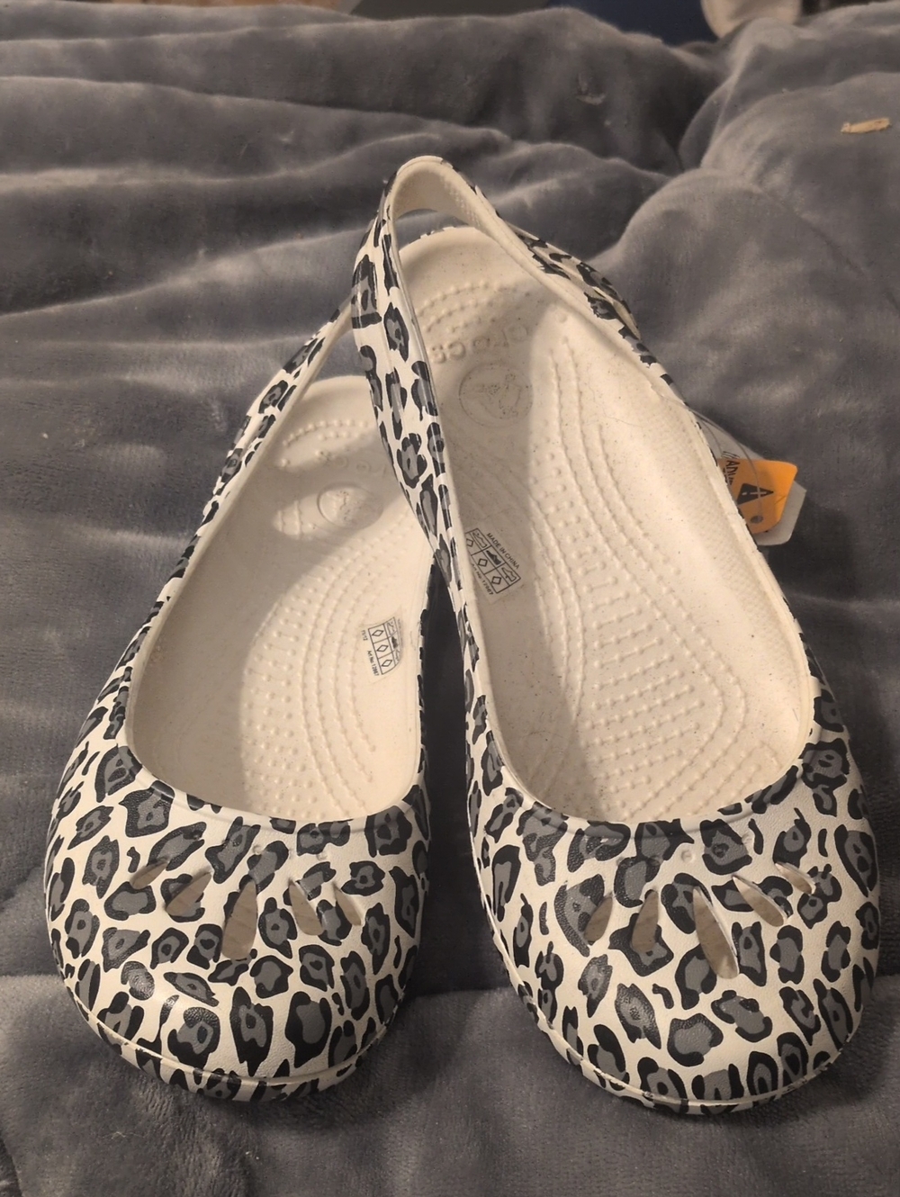 CROCS Women's White and Black Leopard Print Slip-On Flats